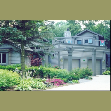 Nestled amoung the tress, this house does not impose itself on the small lot